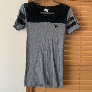 Black and grey t shirt with sequence on the sleeves